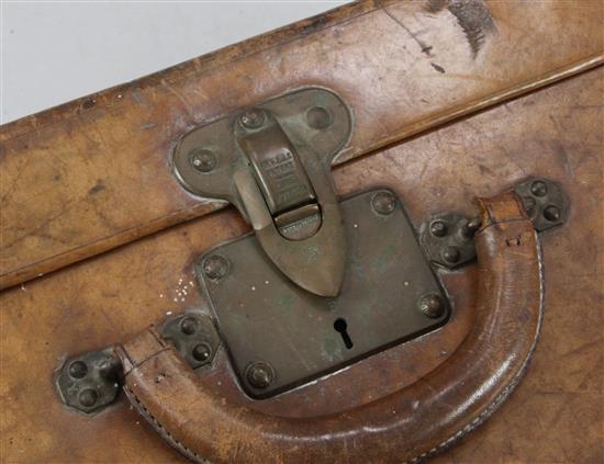 An early 20th century Louis Vuitton tanned leather suitcase, 22.5 x 15 x 8.5in.